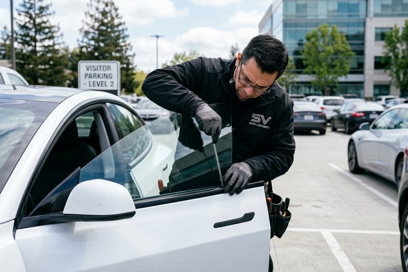 Automotive locksmith unlocking car door in San Jose